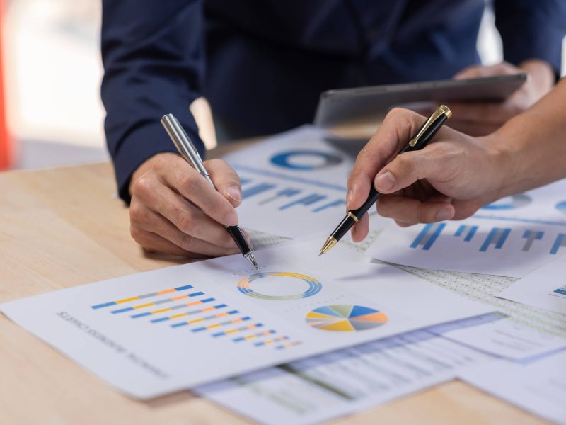 marketing-financial-analyst-analysis-business-financial-report-on-digital-tablet-during-discussion-a.jpg